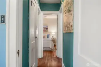 Hallway from second upstairs bedroom towards main bath & Primary bedroom