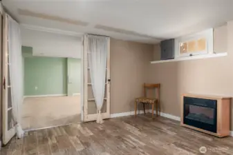 French doors invite you to the 3rd bedroom from basement bonus room
