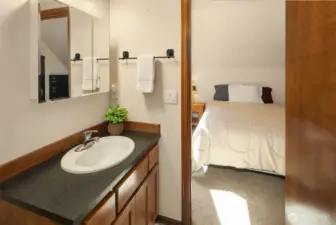 1/2 bath (with toilet and urinal) on upper level. Door leads to extra sleeping space or can be home office, hobby room or you name it!