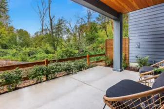 Large covered patio off with expansive views of the nature preserve   Photos are for illustrative purposes only