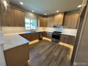 FOR ILLUSTRATION PURPOSES Kitchen features solid quartz counter tops, under mount sink, solid wood cabinets, under cabinets and toe klick lighting and stainless steel appliances