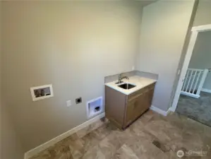 FOR ILLUSTRATION PURPOSES Laundry room includes utility sink, tile floors and window