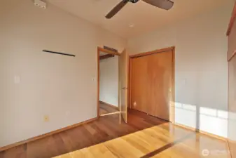 Nice sized closet in the second bedroom and all interior doors are pretty with the natural wood grain.