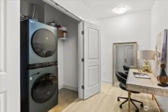 Laundry closet houses newer 'SMART'  Washer/Dryer and extra storage.