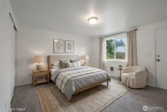 Primary bedroom in the back of the house. 2 of the bedrooms have doors to the outside, making it a great spot for home offices, or guest spaces for rentals.