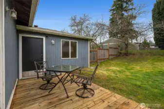 Wood patio off the primary back bedroom.