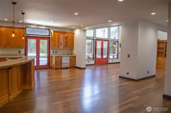 Large entertaining area off the kitchen with wet bar connecting to a step down living room with french doors to a large patio. Can you see all your beautiful furniture here?  So spacious!