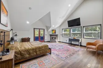 This 2nd floor Primary is more than just a room, it is a sanctuary that provides a blend of luxury, comfort and functionality. Through the French doors is a private balcony where one can enjoy morning coffee or evening relaxation while taking in the picturesque views of the surrounding landscape.  Complete with fireplace for a comfortable and inviting environment.