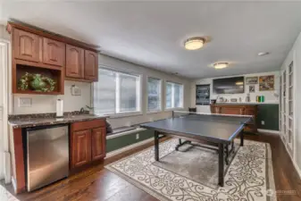 Lower level bonus room, game room or flex space.  It really is a cool space.  Pong or pool anyone?  On this lower level there is a den with great storage, a 1/2 bath and a HUGE storage closet.  With a door to the HUGE back yard this definitely makes this a GREAT entertaining space.