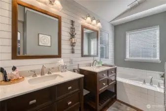 Gorgeous double vanities in the primary beds bath complete with separate bath and shower each with beautiful tile work.