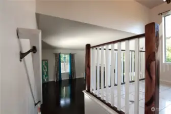 Stairs leading down to the Family room with a  Gas Fireplace.