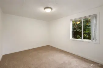 Bedroom two with private garden window.