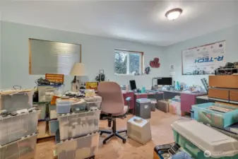Finished bedroom in the upper apartment, currently used as office.