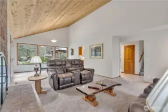 Another view of the living room with large,  river view windows.
