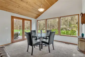 River view dining with french doors leading to paver patio.