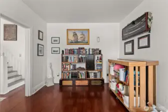Office space off of the living room, stair on the opposite side leading up to the bedrooms