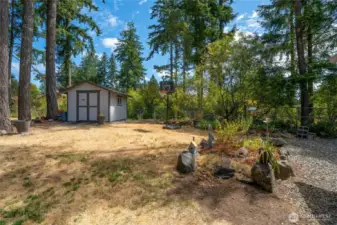 Outdoor shed !!! There is room for a gazebo and any other backyard wonders you might imagine.