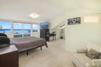 Upstairs large primary suite w/ private balcony and AMAZING westerly views of the Sound and Olympic Mountains.