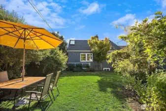 Fenced backyard oasis perfect for relaxing or entertaining.