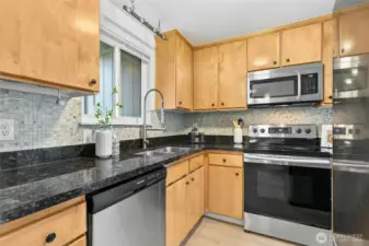 Lovely kitchen with granite countertops.