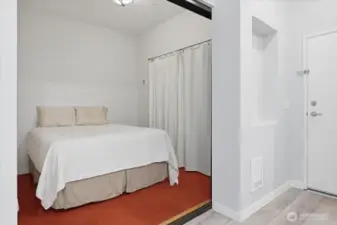 Cozy, efficient bedroom.