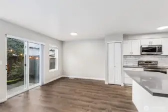 The dining room is situated nicely between the open kitchen and sliding doors to the patio. Great for entertaining in the summer!