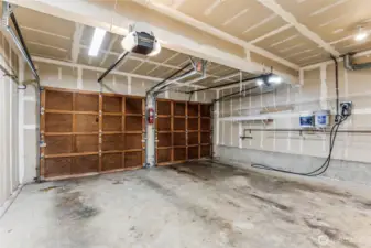 The two car garage has room for extra storage and boasts a 240 volt, 50 AMP EV outlet! The attached charger will go with the seller but can be ordered on Amazon.