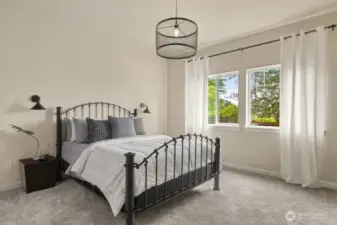 Gorgeous views of the fenced yard and Black Hills await in the main-level primary suite.