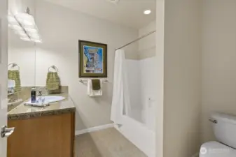 The main-level full bathroom is just past the laundry room.