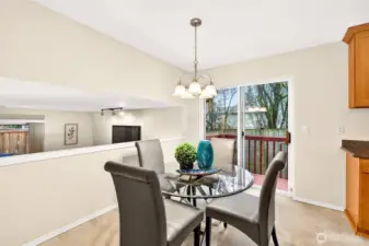 The dining nook sits just off the kitchen with a sliding door that opens to the deck, making indoor to outdoor meals feel natural. It’s an ideal everyday spot for morning coffee, weeknight dinners, or weekend brunch.