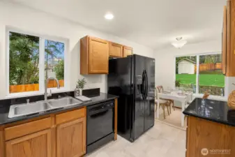 A nice mix of warm wood and back accents. Lots of counterspace!