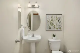 Sweet powder room off the entry.