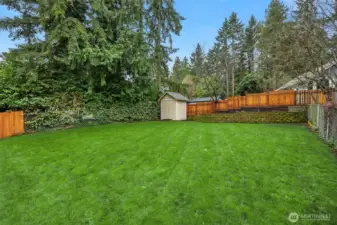 Room to run, backyard games, garden shed and terraced garden beds.