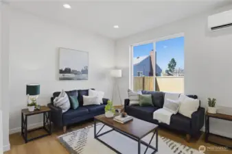 Light-filled living space with large windows and modern finishes