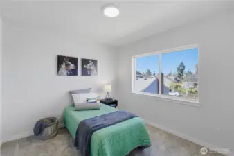 Upstairs bedroom with natural light and functional layout