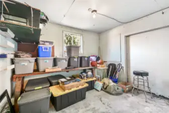 Additional storage area off two car detached garage.