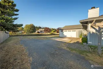 The garage and extra parking space.