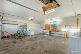 Inside the 2-car garage with laundry, extra storage space and access to the attic.