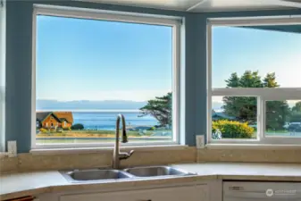 The bay window with lovely water views makes kitchen chores enjoyable.