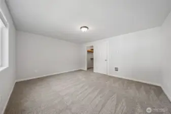 Primary Suite with large walk in closet, new carpet & new paint!