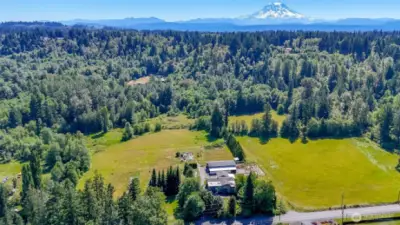 Pastures on both sides of buildings