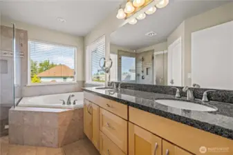 Primary Bedroom includes walk in closet, ensuite 5-piece bathroom w/soaking tub.