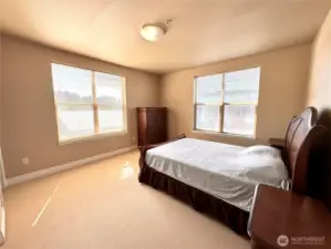 Primary bedroom on southwest corner. Looks toward tennis club