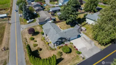 Huge corner lot, fenced back yard, tons of parking for vehicles, RV, boat.
