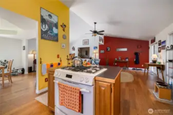 The kitchen has a center island w/room for seating and a gas range.  Vaulted ceilings in throughout the listing area.
