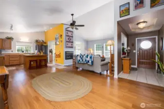The open living area features a vaulted ceiling, bamboo flooring, and lots of natural light.