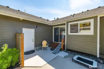 One of two sliders to access the back yard and patio area.  White door leads to the garage.