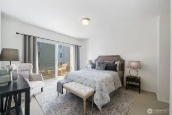 The primary suite also has it's own balcony beyond the large sliding glass door.