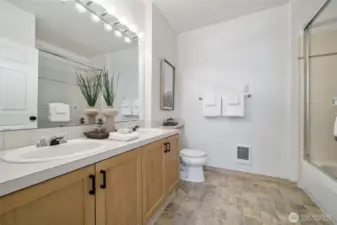 Two sinks and plenty of space in this full primary bath.