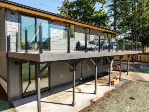 balcony stretches all across the back of the home.